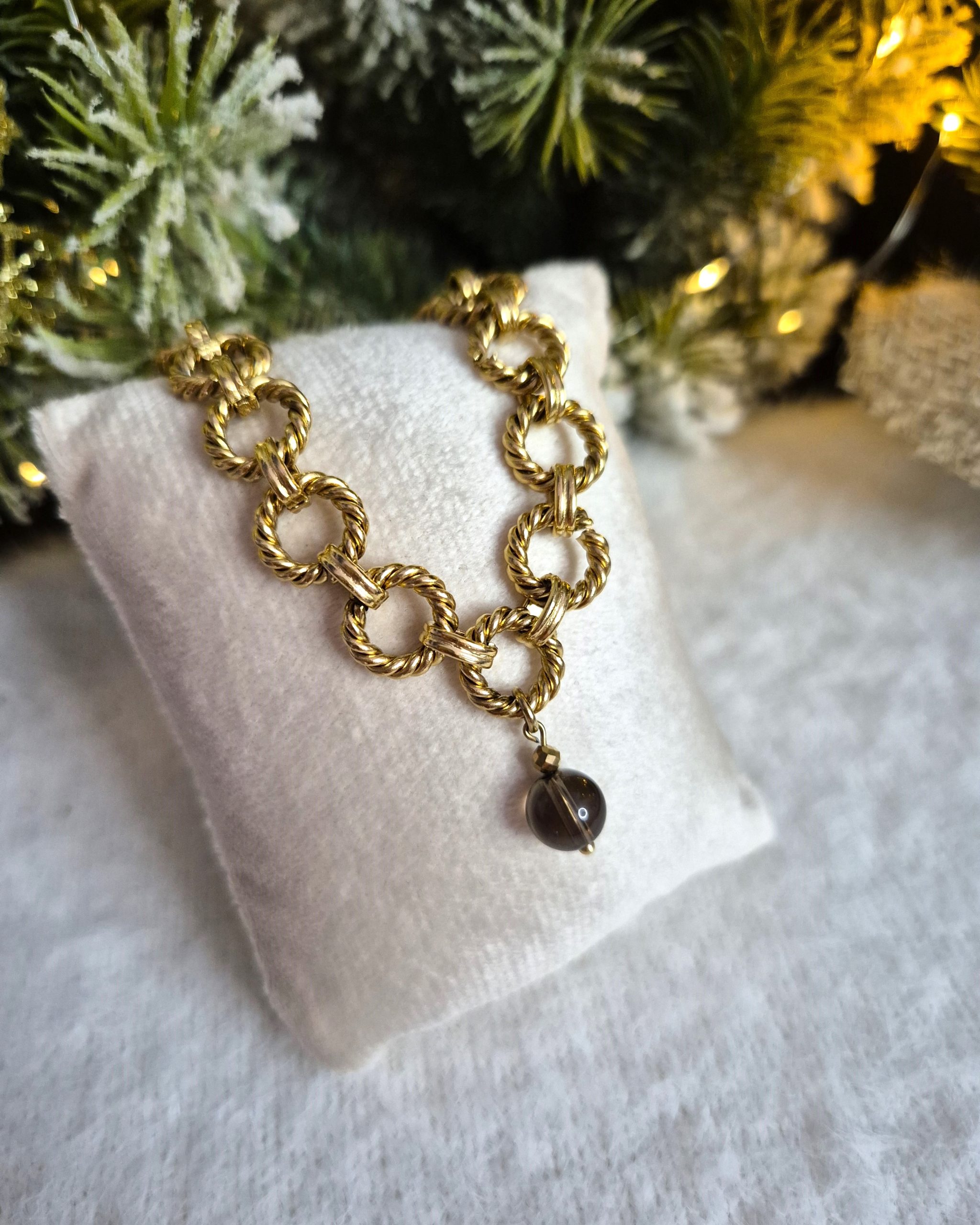 Plecione koła - naszyjnik ze stali z zawieszką Kwarcu dymnego